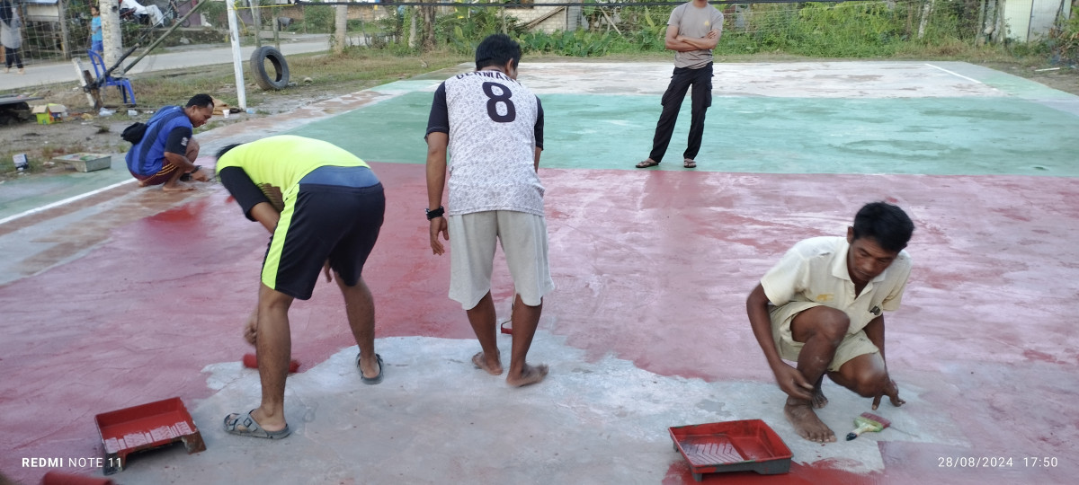 Pengecatan lapangan voly