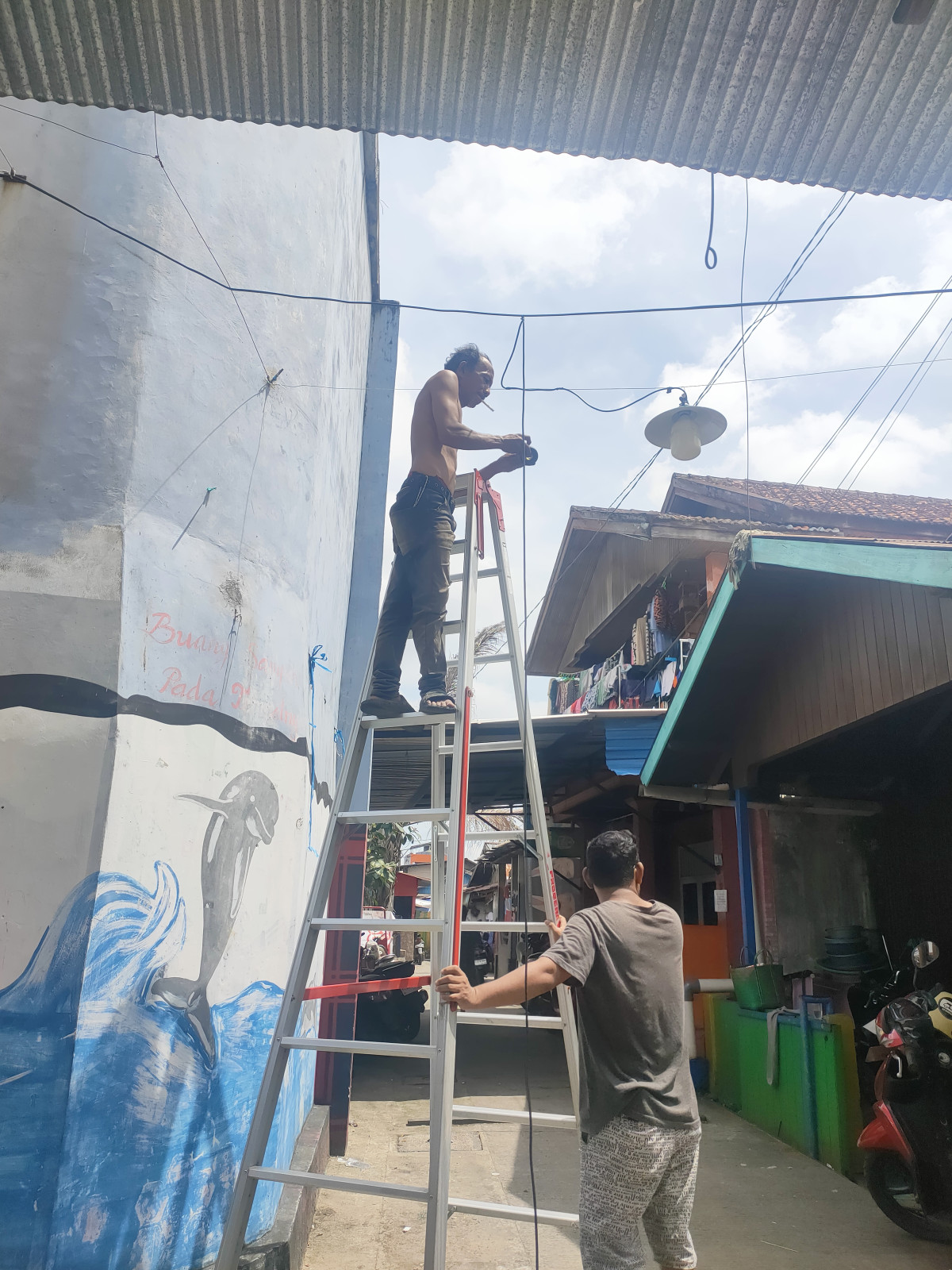 brsihkan langgar al kautsar dan pemasangan penerangan jalan